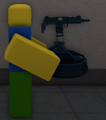 Gun Roomba, being held by a player.
